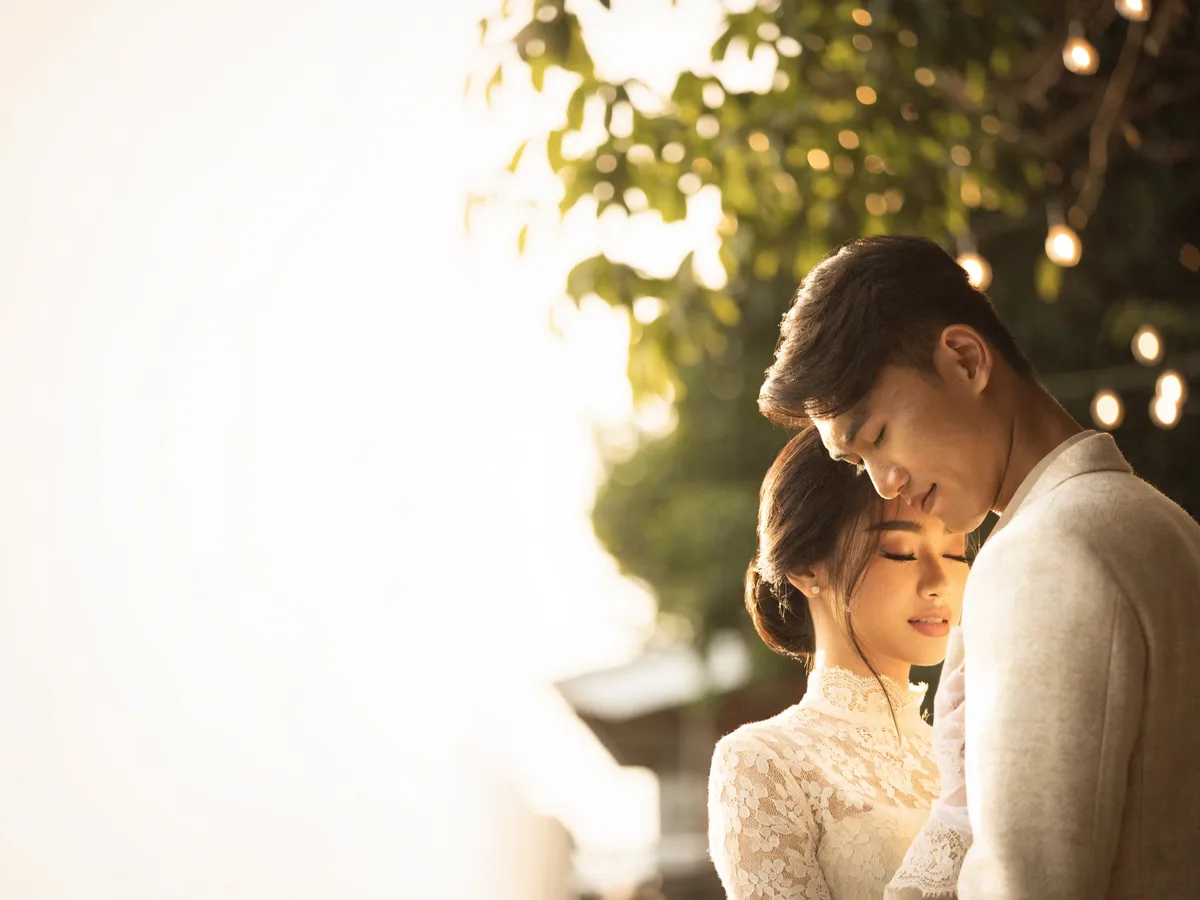 A Cambodian couple celebrating at their wedding reception